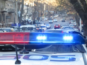 Police car travels through congested traffic