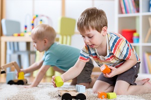 Children play with toys at their daycare facility