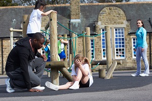 A child has been hurt by a fall on the playground of a daycare facility