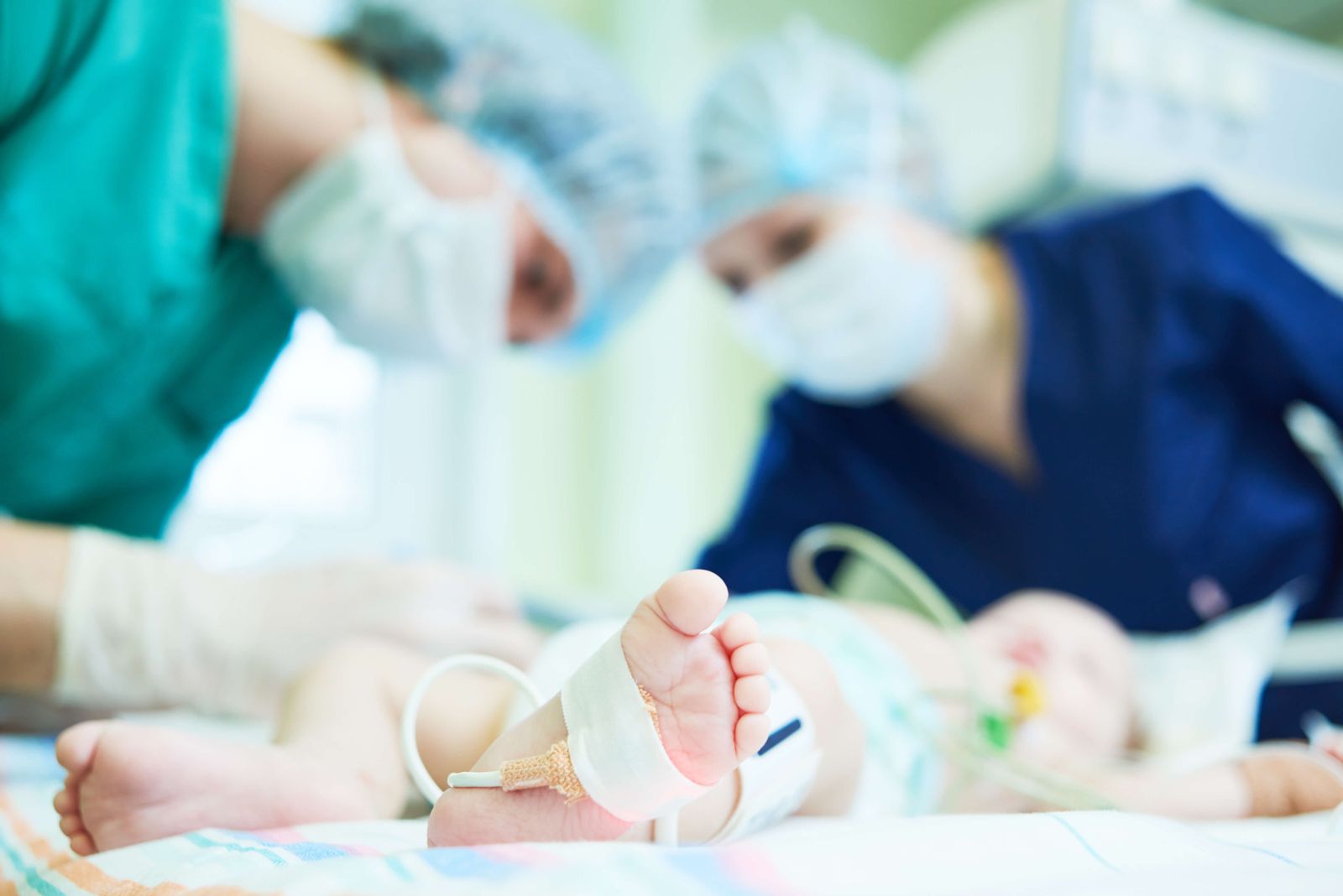 Doctors Treating Infant