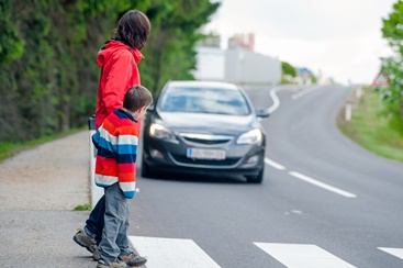 Pedestrians Waiting at a Four Way Stop