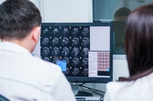 attorneys reviewing brain scan test results