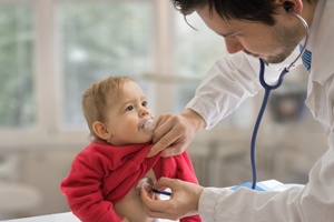 baby being examined by a doctor
