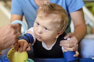 baby with cerebral palsy getting rehabilitation therapy