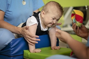 baby with cerebral palsy in physical therapy
