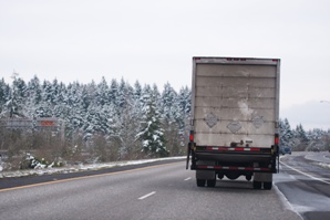 back of semi truck on snowy road