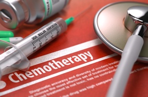 chemotherapy syringe medication stethoscope on red background