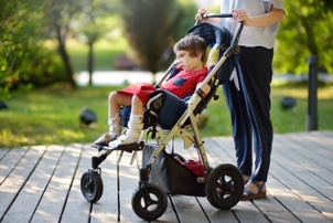 child with cerebral palsy in a wheelchair stroller