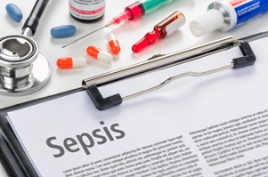 clipboard with sepsis information sheet and medications