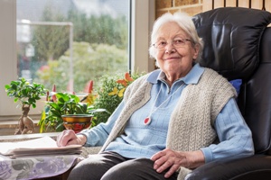 content nursing home resident smiling at camera