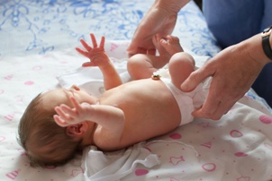 doctor-examining-a-newborn-baby