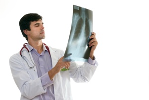 doctor looking at chest x-ray