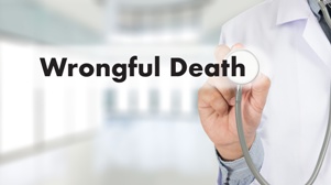 doctor with stethoscope and words wrongful death on screen