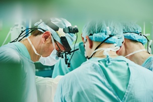 doctors performing surgery in a hospital operating room