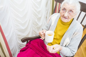 Elderly woman taking medication