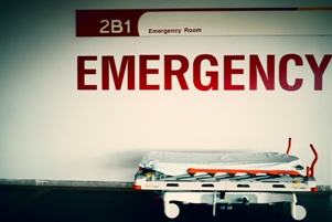 emergency room sign over hospital gurney