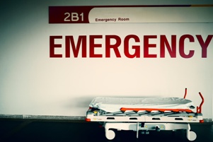 emergency room sign over hospital gurney