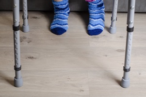 feet of person using walker for assistance