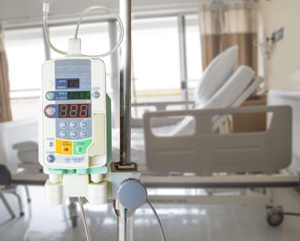 infusion pump for chemotherapy with hospital bed in background