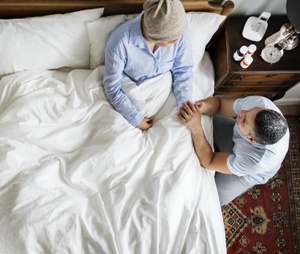 man comforting wife after chemotherapy