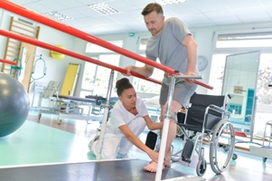 man getting physical therapy to help with walking