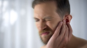 man showing symptoms of meningitis