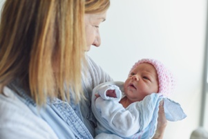 mom-holding-newborn-baby