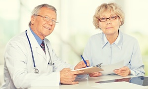 nursing home doctor talking to resident