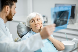 nursing home resident with toothache Gray & White