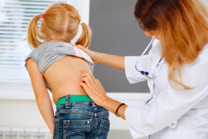 scoliosis caused during labor or delivery