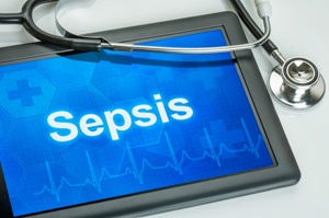 tablet showing word sepsis and stethoscope