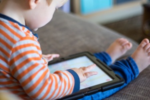 toddler using laptop tablet for communication